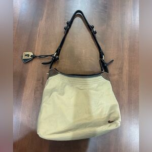 Dooney and Bourke women’s purse. Beige material with brown and black leather.